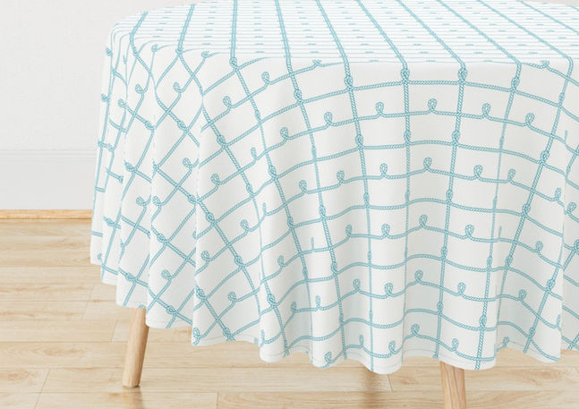 A slightly creased piece of fabric featuring a grid of teal blue ropes with knots by lenes_linien.