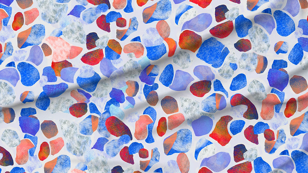 A slightly creased piece of fabric featuring abstract, textured shapes resembling mediterranean terrazzo stone floors.