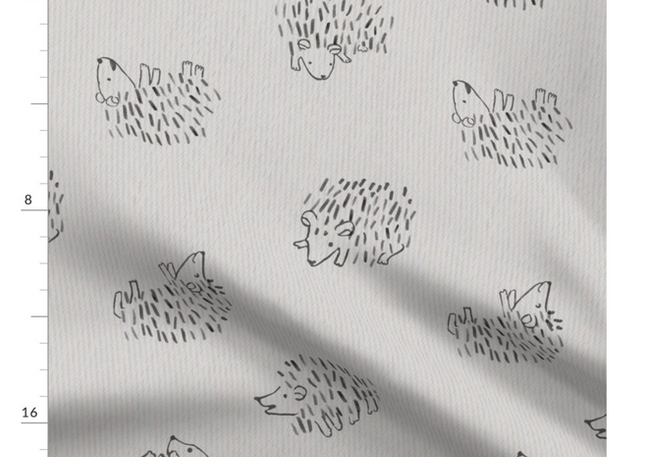 A slightly creased piece of fabric featuring a tossed design of cute, minimalist hedgehogs drawn in loose line-art sketches on uni-colored background by lenes_linien