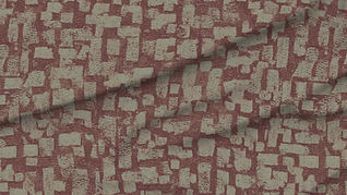 A slightly creased piece of fabric featuring a distressed irregular block maze mosaic in muted red and green by lenes_linien.