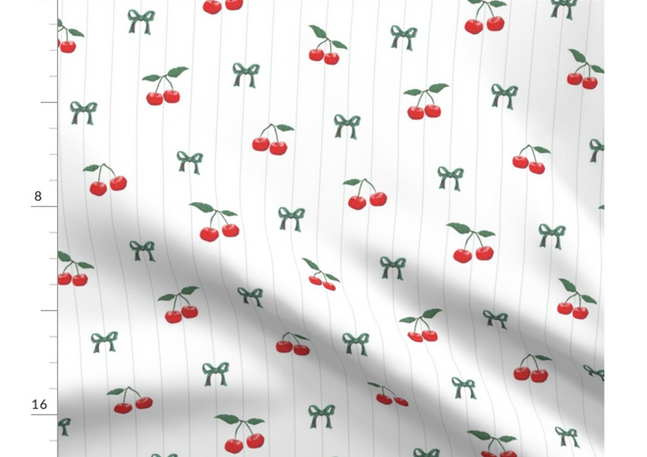A slightly creased piece of fabric featuring a design of red cherries with green stems and Stripes on White by lenes_linien