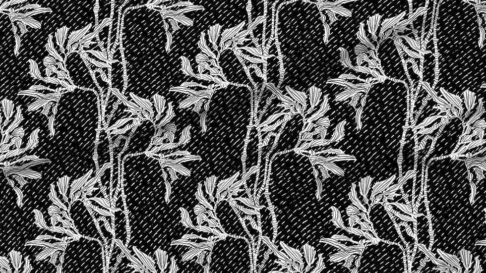 A slightly creased piece of fabric featuring an elegant duotone design of sea kelp fronds in a blockprint style.