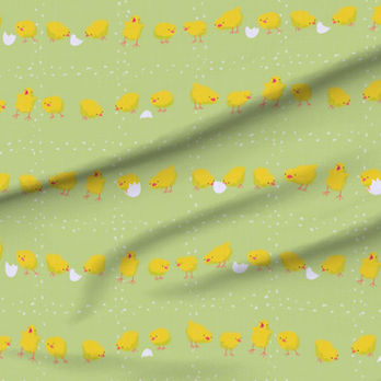 A slightly creased piece of fabric featuring a design of yellow tiny chicklets picking a grid formed of kernels by lenes_linien