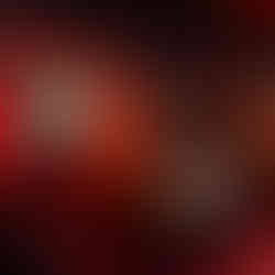 Cozy F1 Las Vegas suite with red lounge chairs and ambient lighting design