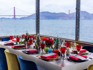 Elegant holiday table setting overlooking San Francisco Bay and Golden Gate Bridge