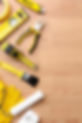 yellow-repair-kit-wooden-background.jpeg