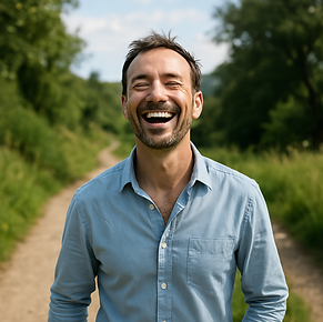 Smiling man on countryside path, calm and confident – representing emotional reset and personal growth through hypnotherapy