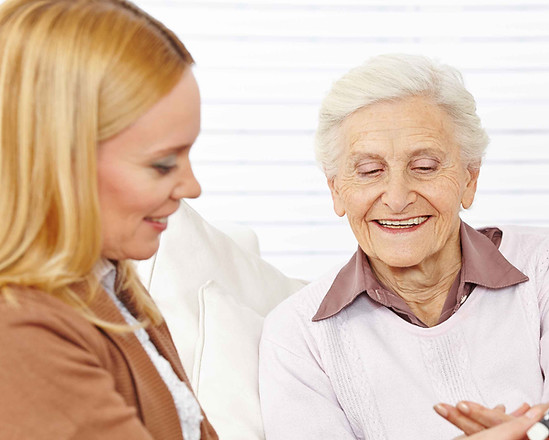 helping an elderly woman