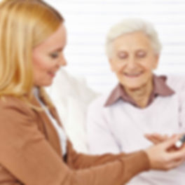 Pharmacist helping elderly woman