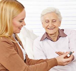 Pharmacist helping elderly woman