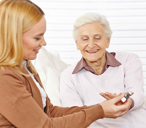 Pharmacist helping elderly woman