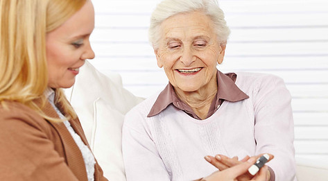 Pharmacist helping elderly woman