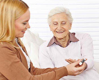 Pharmacist helping elderly woman