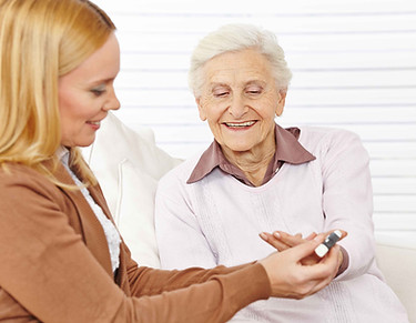 Pharmacist helping elderly woman