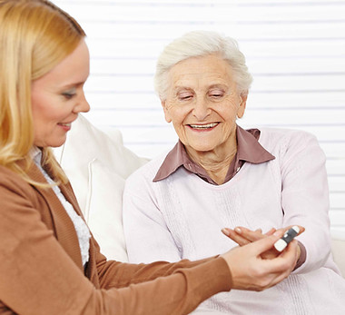 Pharmacist helping elderly woman