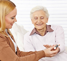 Pharmacist helping elderly woman