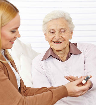 Pharmacist helping elderly woman