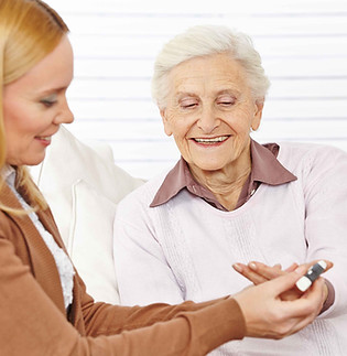 Pharmacist helping elderly woman