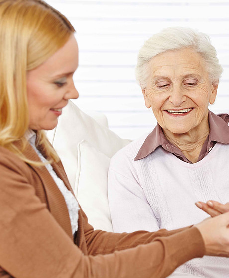 Pharmacist helping elderly woman