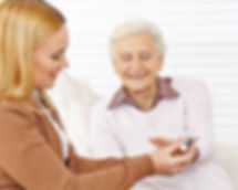 Pharmacist helping elderly woman