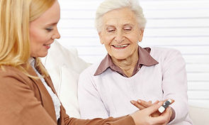 Pharmacist helping elderly woman