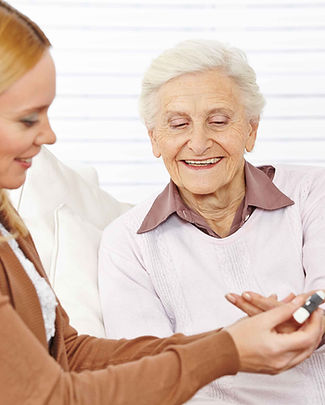Pharmacist helping elderly woman