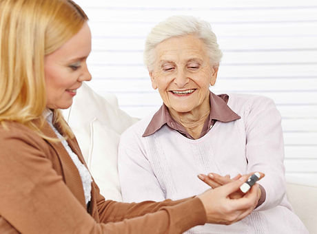 Pharmacist helping elderly woman