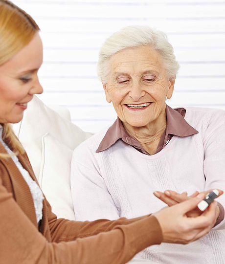 Pharmacist helping elderly woman
