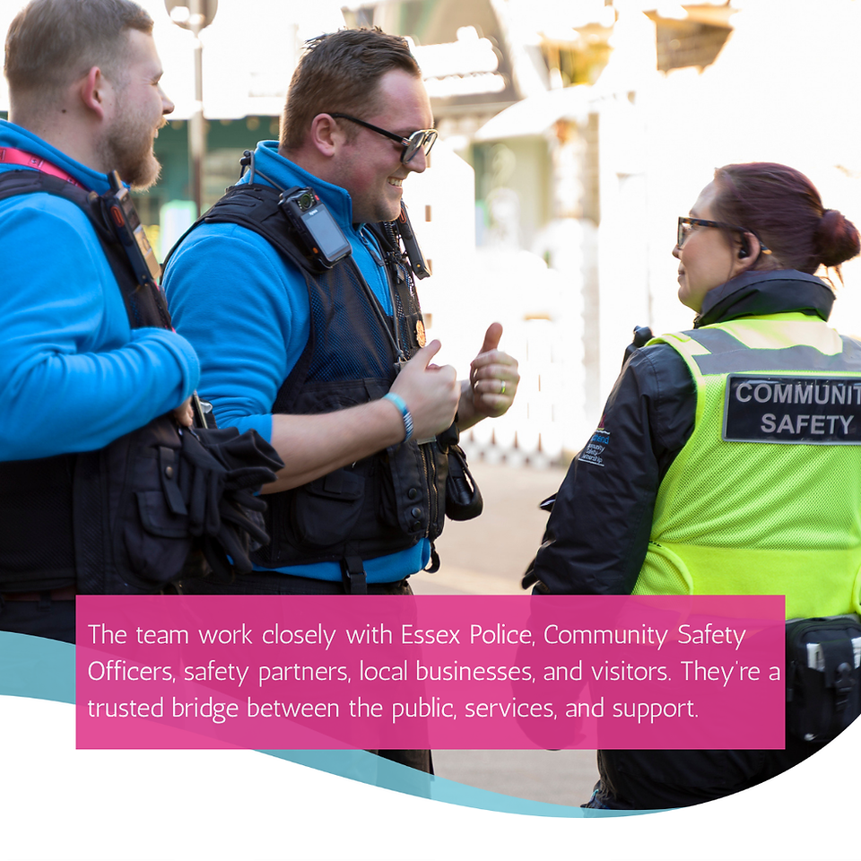 two uniformed male street rangers in black and blue joke and smile with a female community safety officer wearing a high vic tact vest.