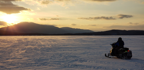 Snowmobiling at Sunset