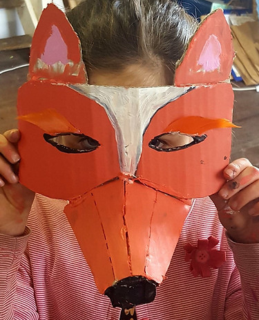 Child wearing a Fox mask they made at Rebecca Prince's Adelaide hills art classes for kids