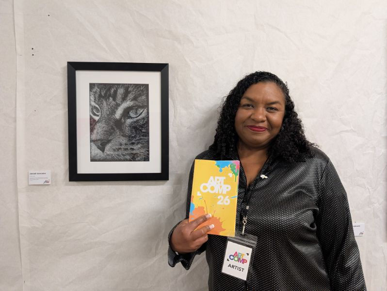 Artist Janadi Gonzalez next to her painting True Love at the launch of Art Comp 2026 at 100 Kellogg's London ON