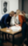 Image of researchers collaborating around a table