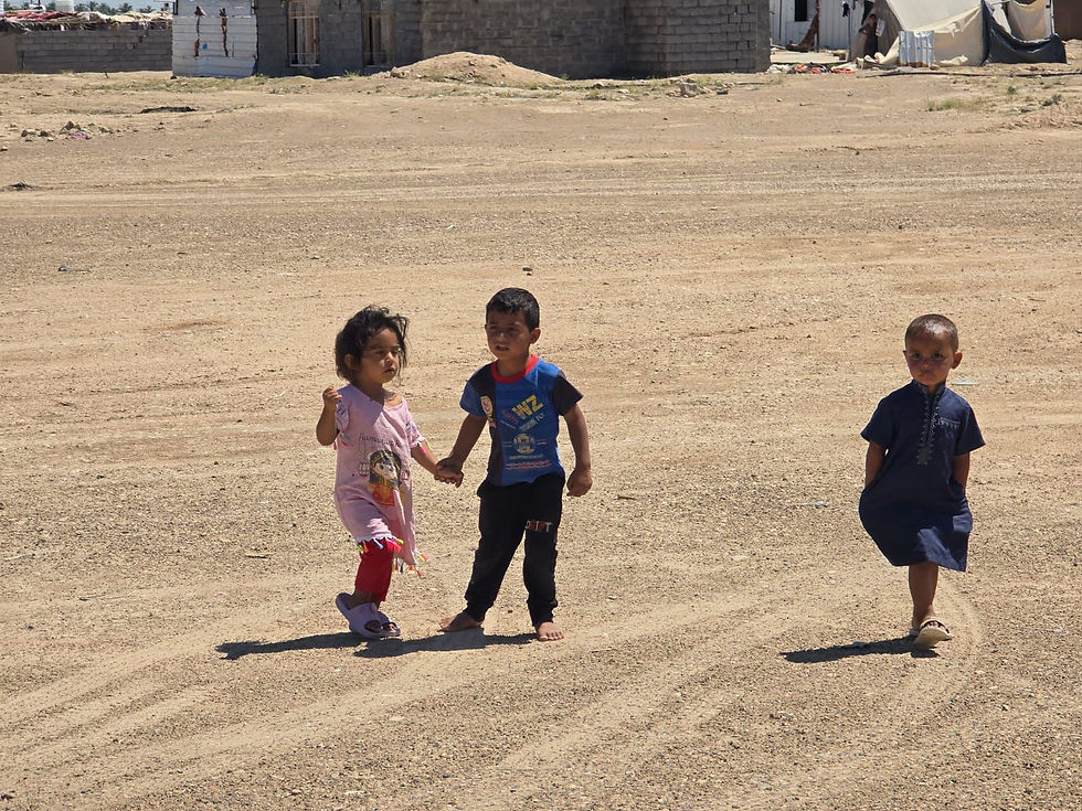 Children at Bzeibiz camp, during Mercy Hands' emergency food and hygiene kit distribution. 