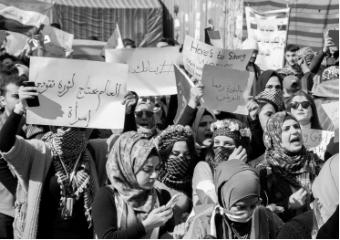 Women in Iraq at a protest in black and white. 