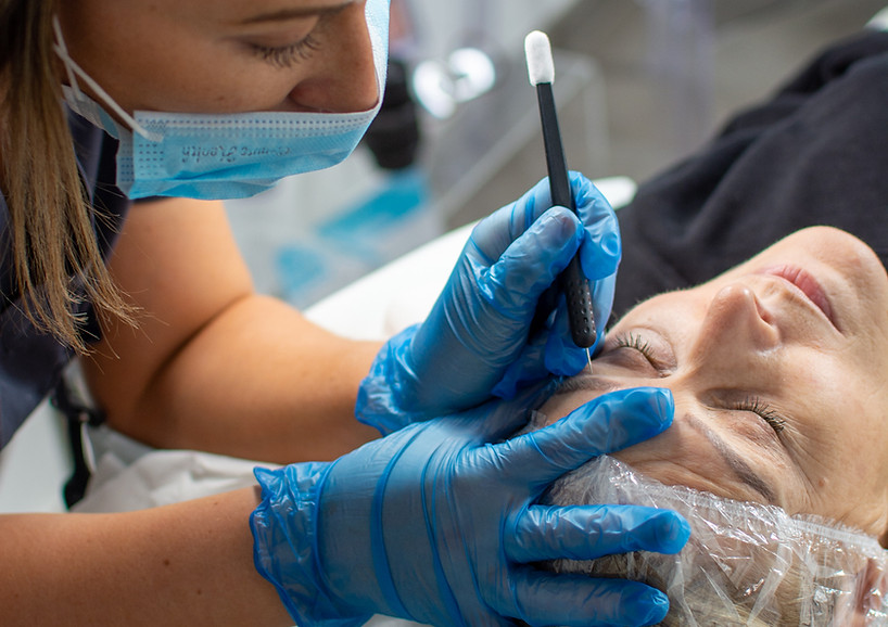 Woman recieving a treatment at Ink & Glow, 5* review clinic in Welwyn Hertfordshire