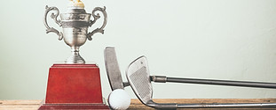 Golf Clubs, Ball and Trophy
