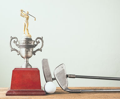 Golf Clubs, Ball and Trophy