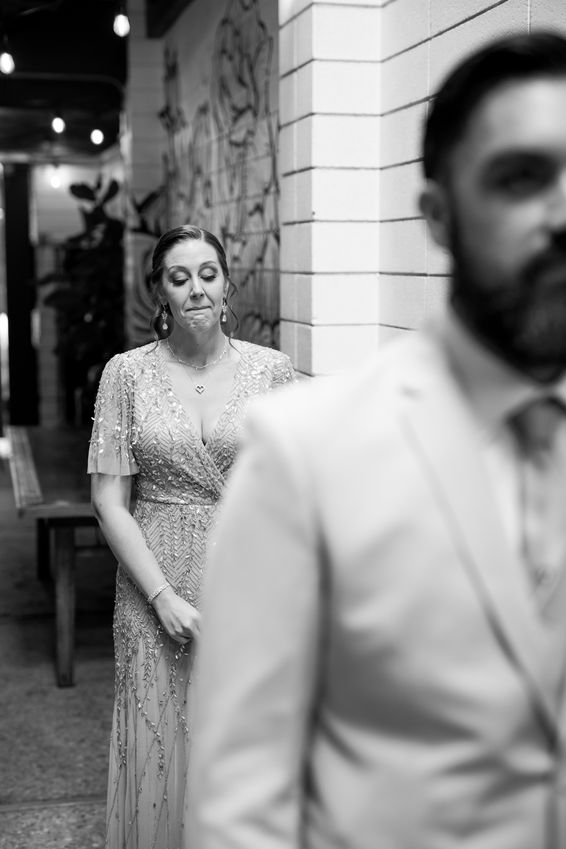 Emotional moment of bride and groom during a first look at the Century in Downtown Modesto, CA.