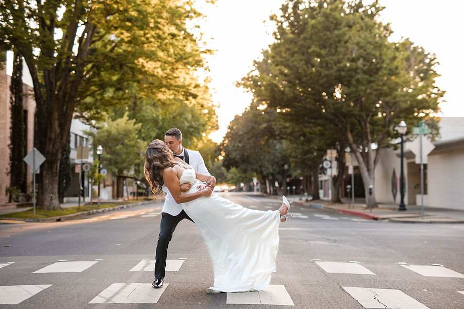 Bride-groom-dip-kiss-street-Sterling-Hotel-Sacramento.jpg