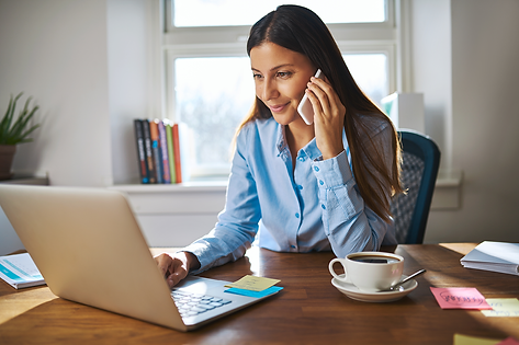 Woman on phone and computer