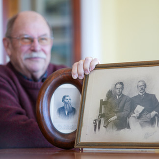 McPheeters holds portraits of family members.