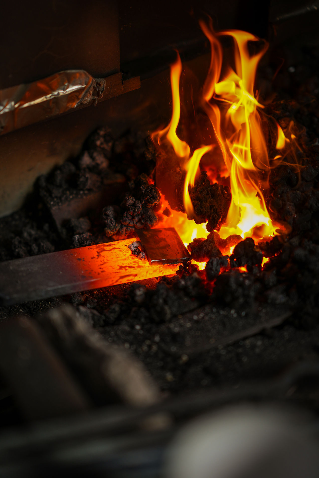 Silas Wolff heats up some  steel at his Kennebunkport workshop.