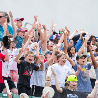 Kids cheer during Education Day at Hadlock Field.