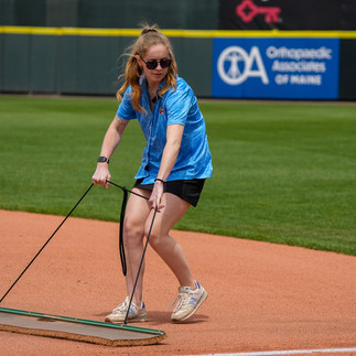 Emily Morin works for the Portland Sea Dogs in sponsorships and promotions. And helps the grounds crew!
