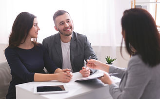 young-family-listening-to-financial-advisor-ready-2021-08-26-16-33-55-utc.jpg
