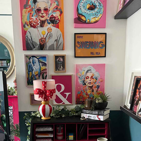 A vibrant pink gallery wall collection of quirky modern art prints