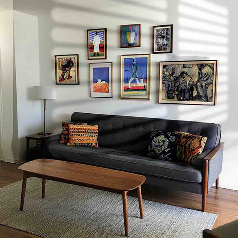 A modernist interior featuring bold abstract and modern art prints of Kazimir Malevich's modern masterpieces