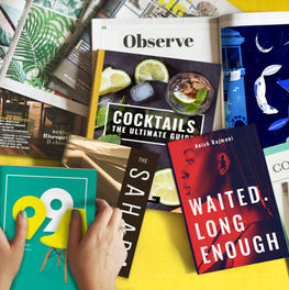 A collection of books and magazines on a yellow background.