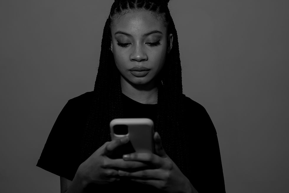 front-view-woman-holding-smartphone_edited.jpg